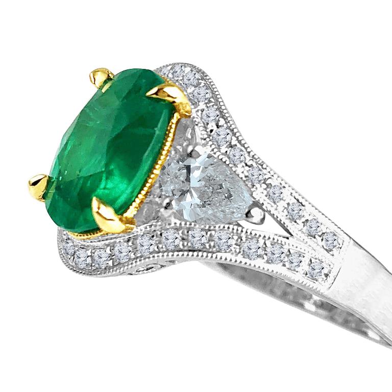 With a GIA Certified 2.38 carat oval cut fine emerald center, and 0.86 carats white diamonds, this ring shines from every angle.

GIA Certification details (see photo):
The center emerald is transparent, green, 10.66mm by 7.61mm

Center: 2.38 carat