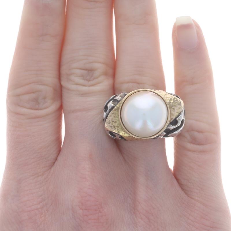 Size: 6 1/2

Brand: Dian Malouf

Metal Content: Sterling Silver & 14k Yellow Gold

Stone Information
Cultured Mabe Pearl
Color: White

Style: Solitaire
Features: Hammered Detailing

Measurements
Face Height (north to south): 21/32