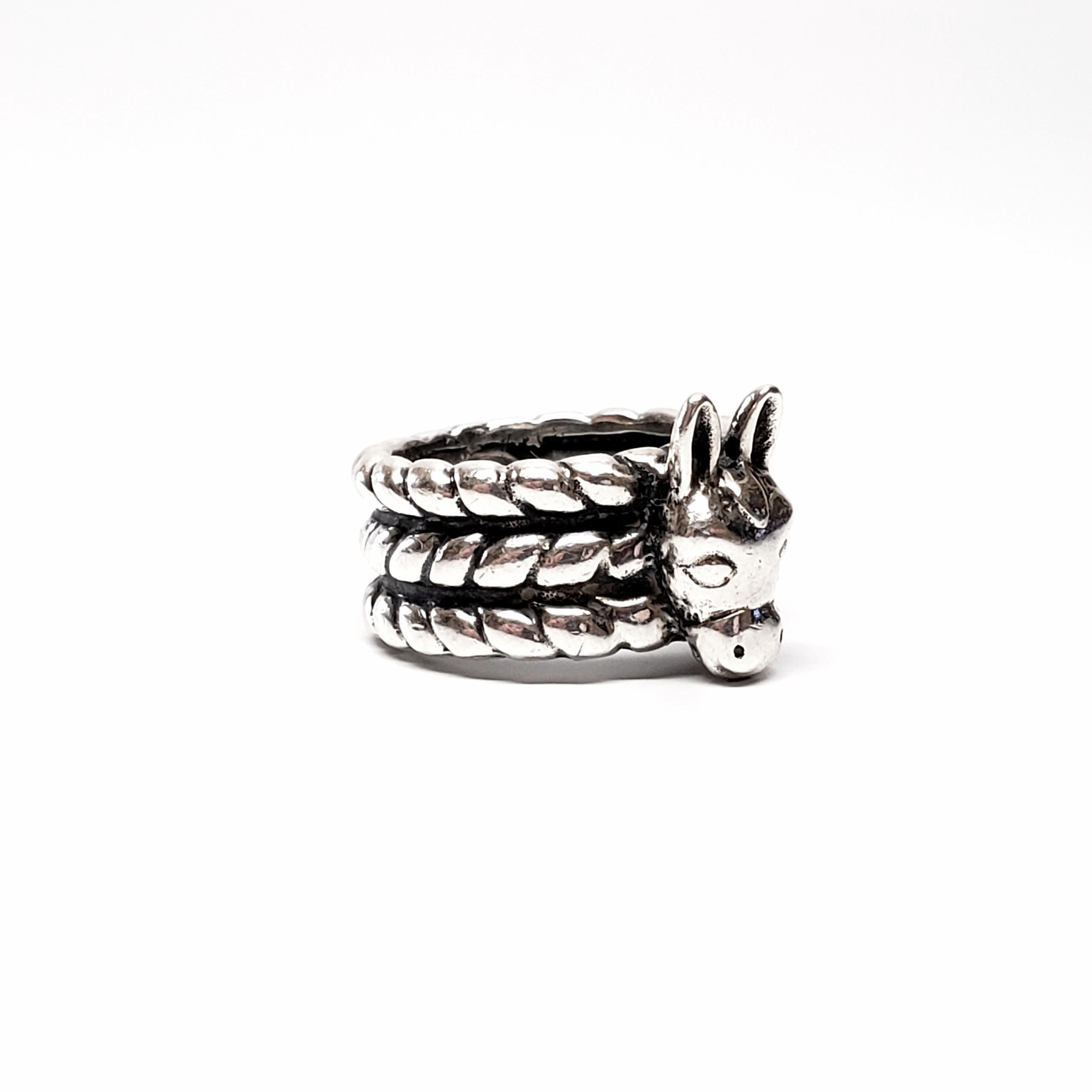 Sterling silver Texas Donkey ring by Dian Malouf.

Size 5 3/4

Dian Malouf is known for her bold design of silver and gold jewelry. Often her pieces are instantly recognizable. This vintage piece features a donkey head on a wide tri-rope band.

Band