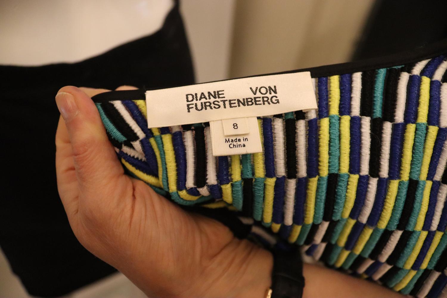 A great jacket for Spring/ Summer by Diane von Furstemberg. In a silk knit, the jacket is a colourful combination of vertical blocks. The colours are blue, black , white , turquoise and yellow.
The jacket has a zip front fastening. round neckline