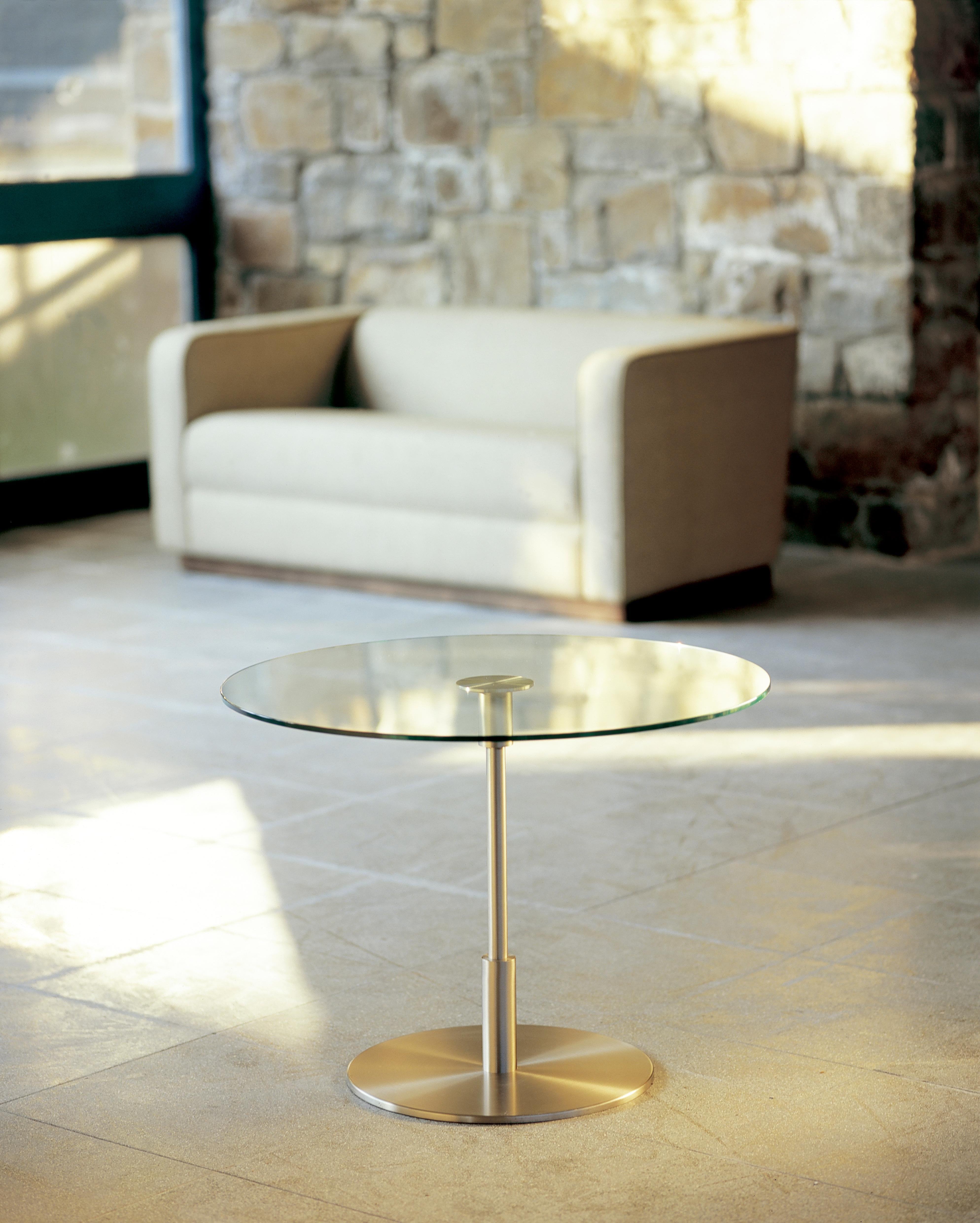 Diana Alta side table by Federico Correa, Alfonso Milá, Miguel Milá
Dimensions: D 58 x H 62 cm
Materials: Metal, tempered glass.
Available in 2 sizes: D58 x H62, D70 x H52 cm.

The Diana table is the embodiment of eloquent timelessness. Its