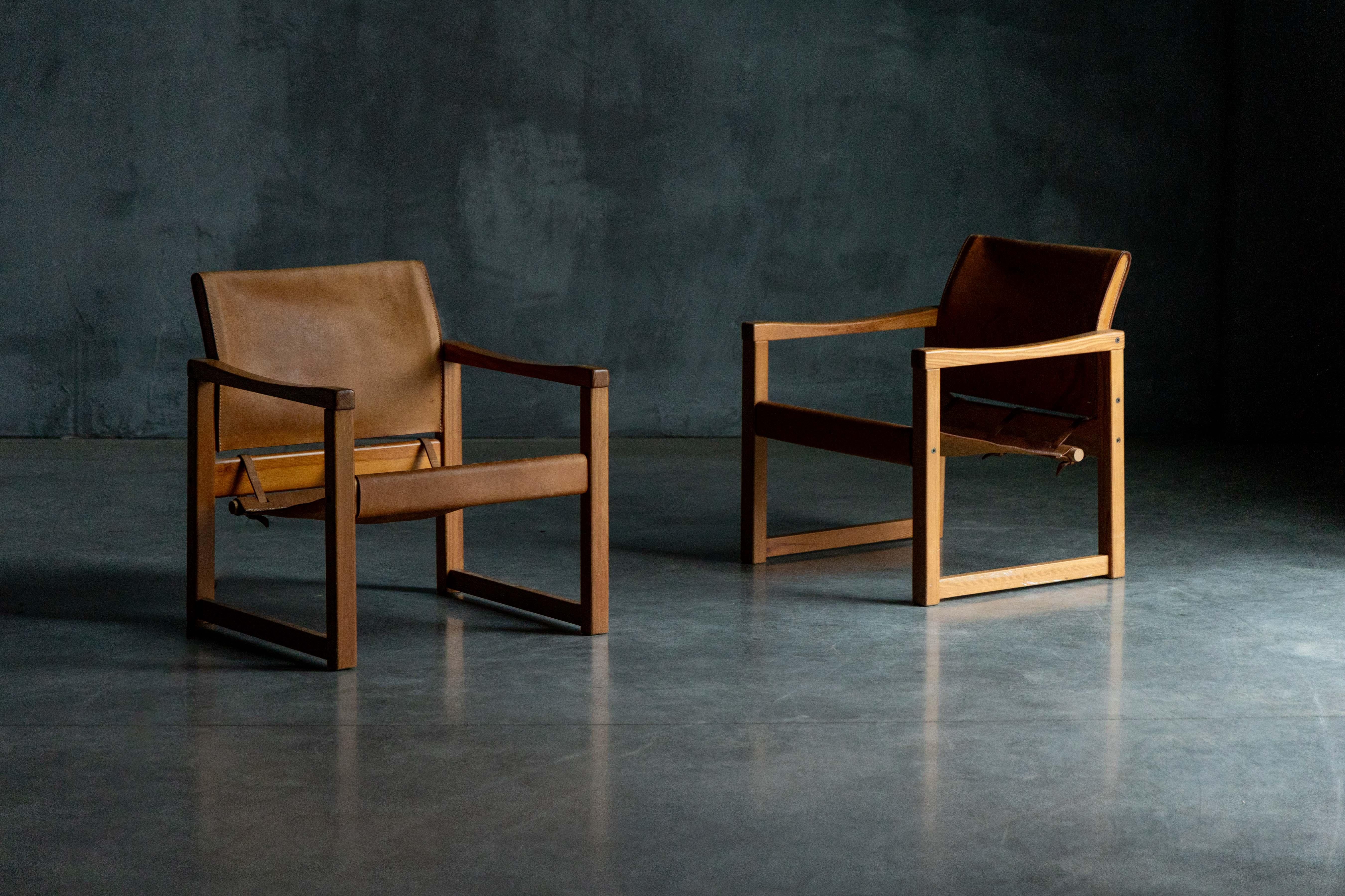 Experience timeless Scandinavian design with the Safari Diana Armchairs by Karin Mobring for IKEA, crafted in the 1970s. These iconic chairs feature rich, patinated leather that exudes vintage charm, supported by sturdy wooden frames. The Diana