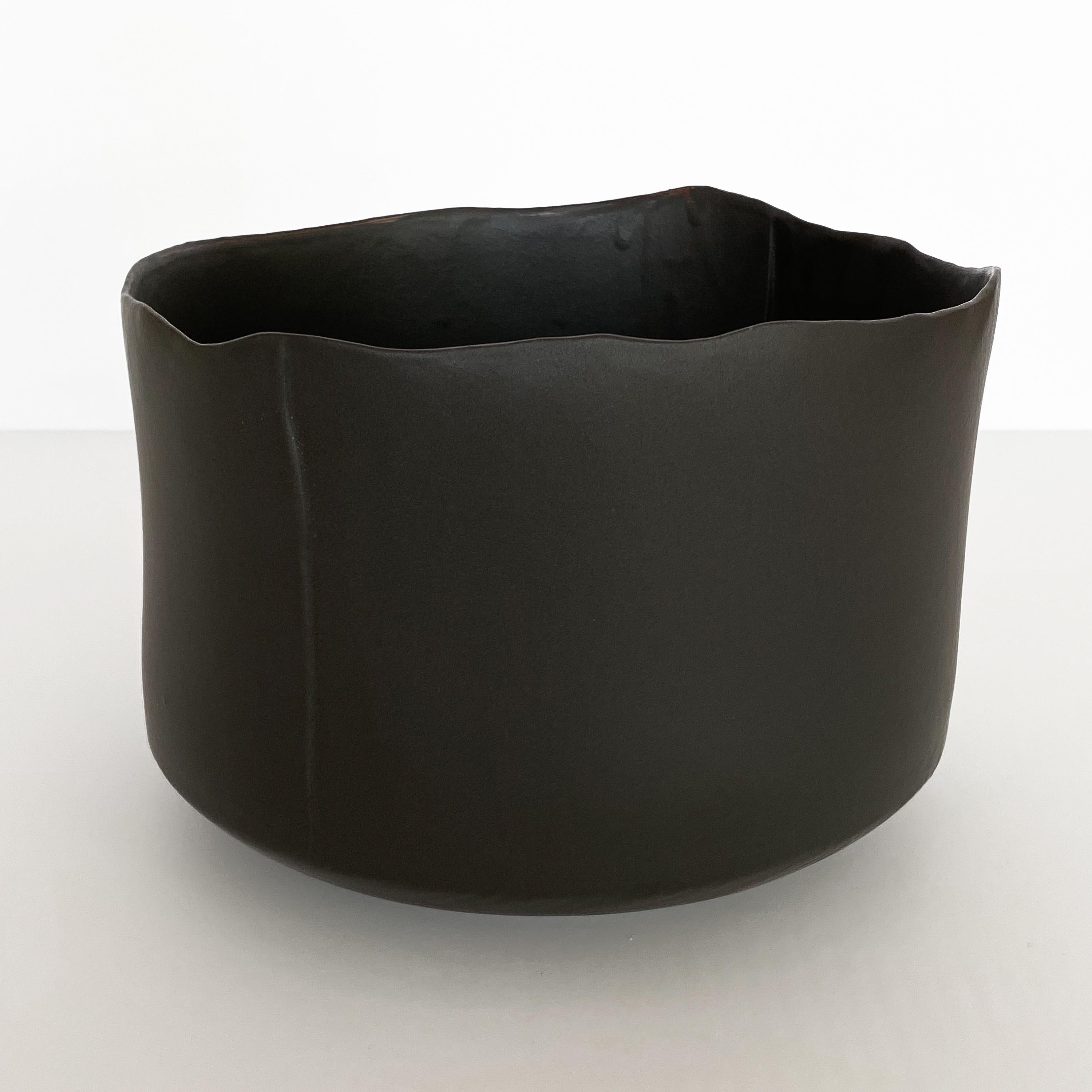 Matte black glazed earthenware bowl by Diana Gillispie. Minimalist and modern in form. Measures: 7