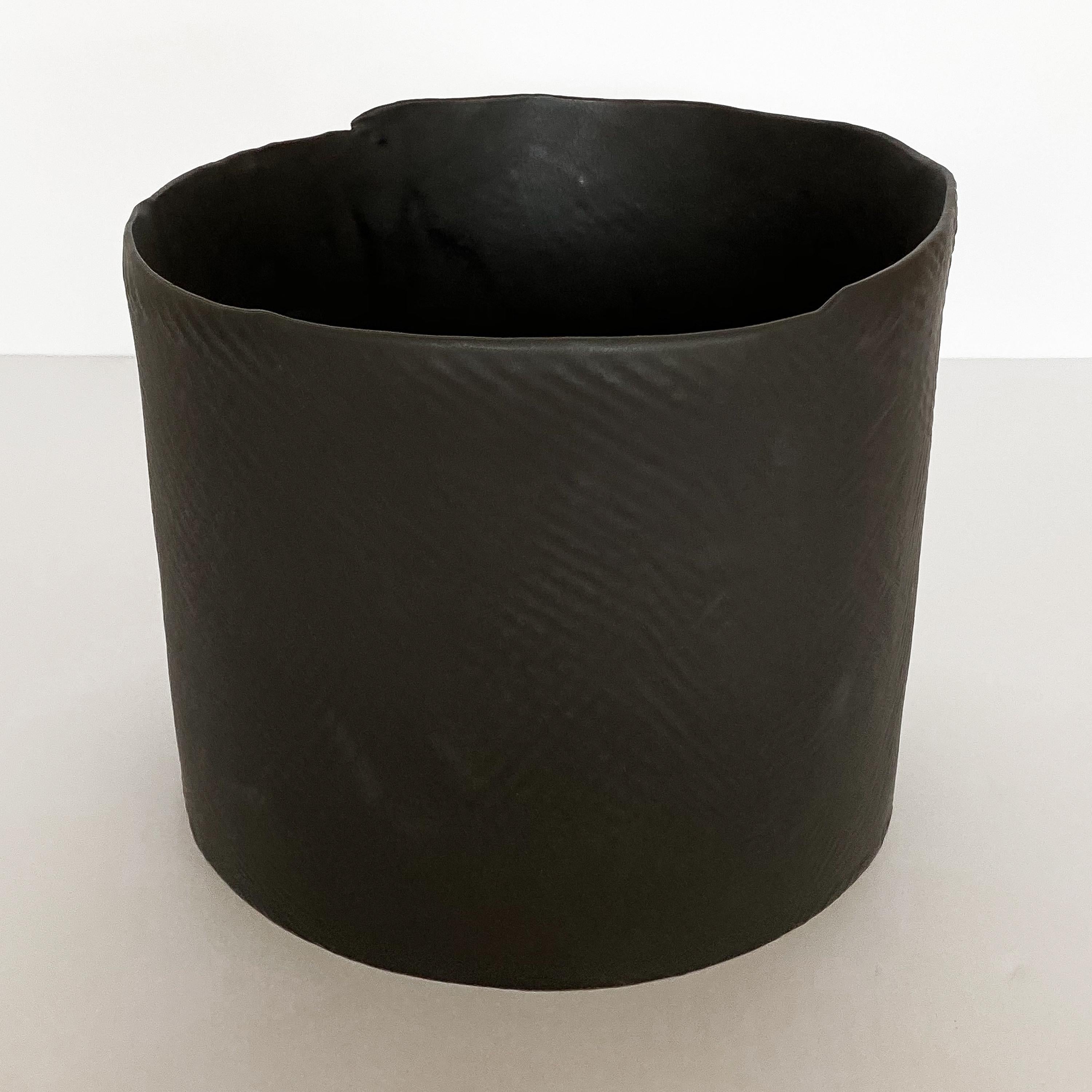 Matte black glazed earthenware bowl with textured exterior by Diana Gillispie. Minimalist and modern in form. Measures: 8