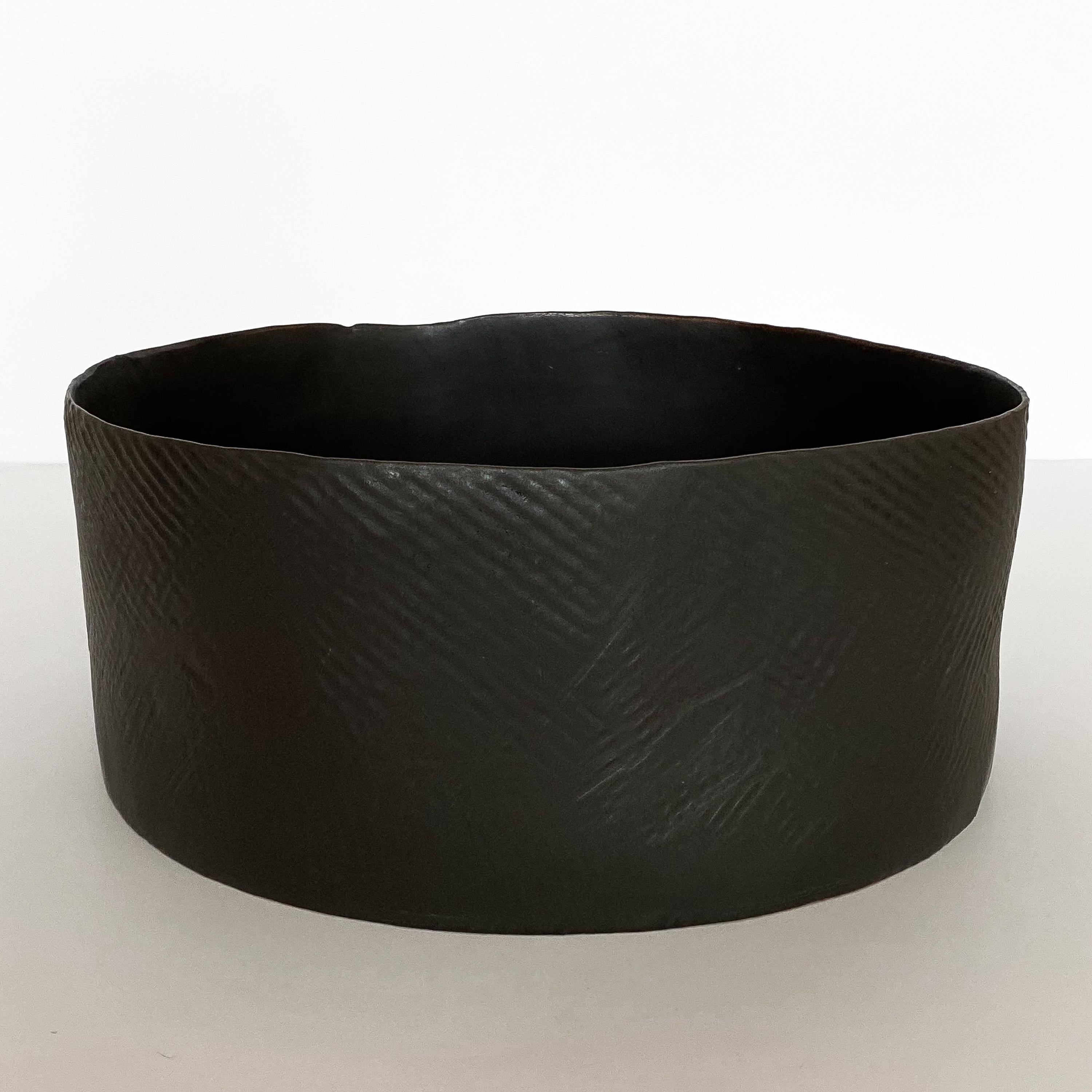 Matte black glazed earthenware bowl with textured exterior by Diana Gillispie. Minimalist and modern in form. Measures: 5.75