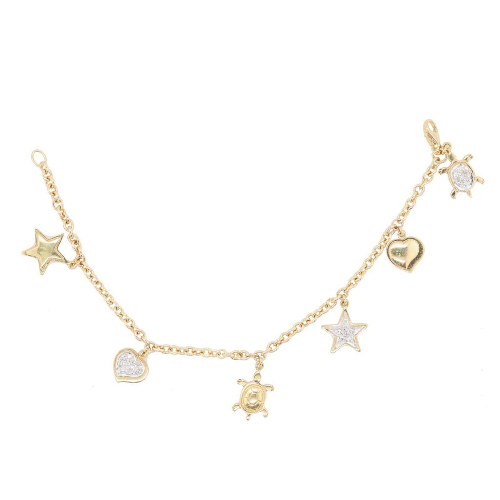 18kt yellow gold star, turtle, and heart bracelet featuring 0.35 cts of diamonds