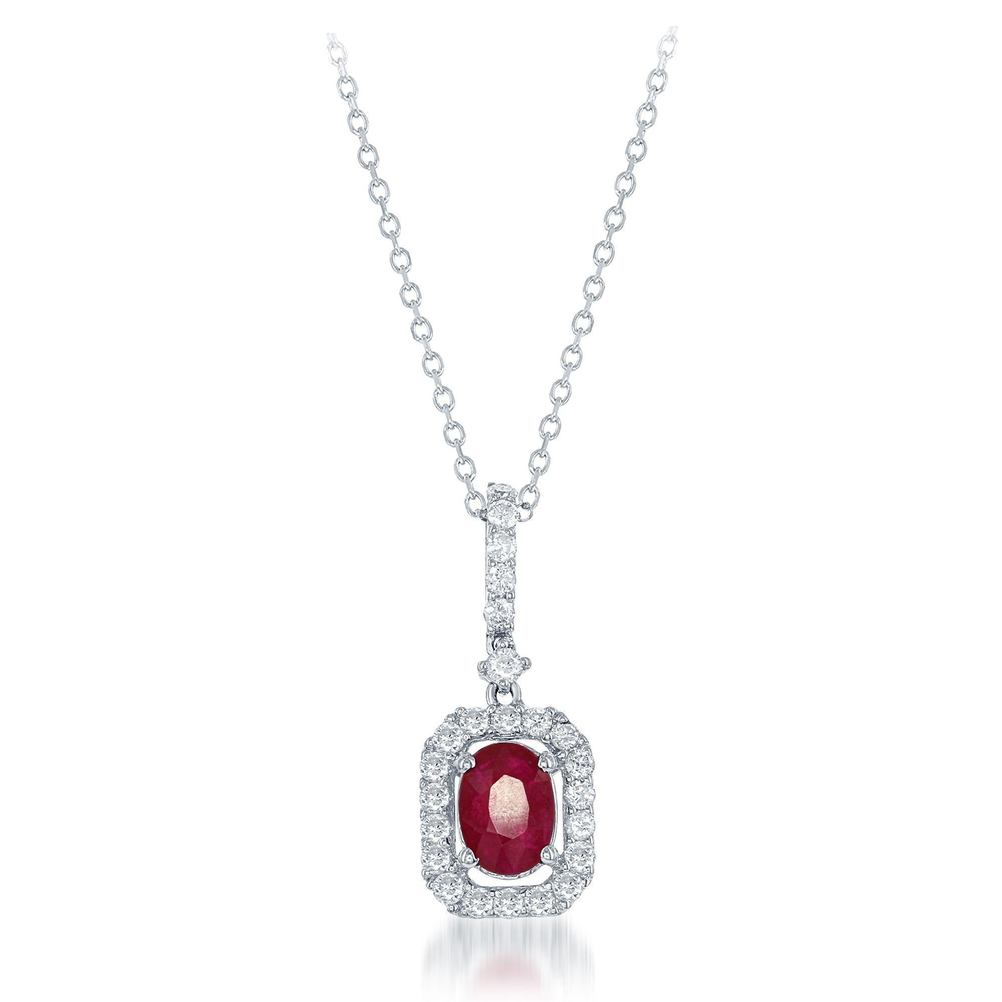 1.00ct oval ruby surrounded by 0.70 cts round diamonds creating a halo pendant