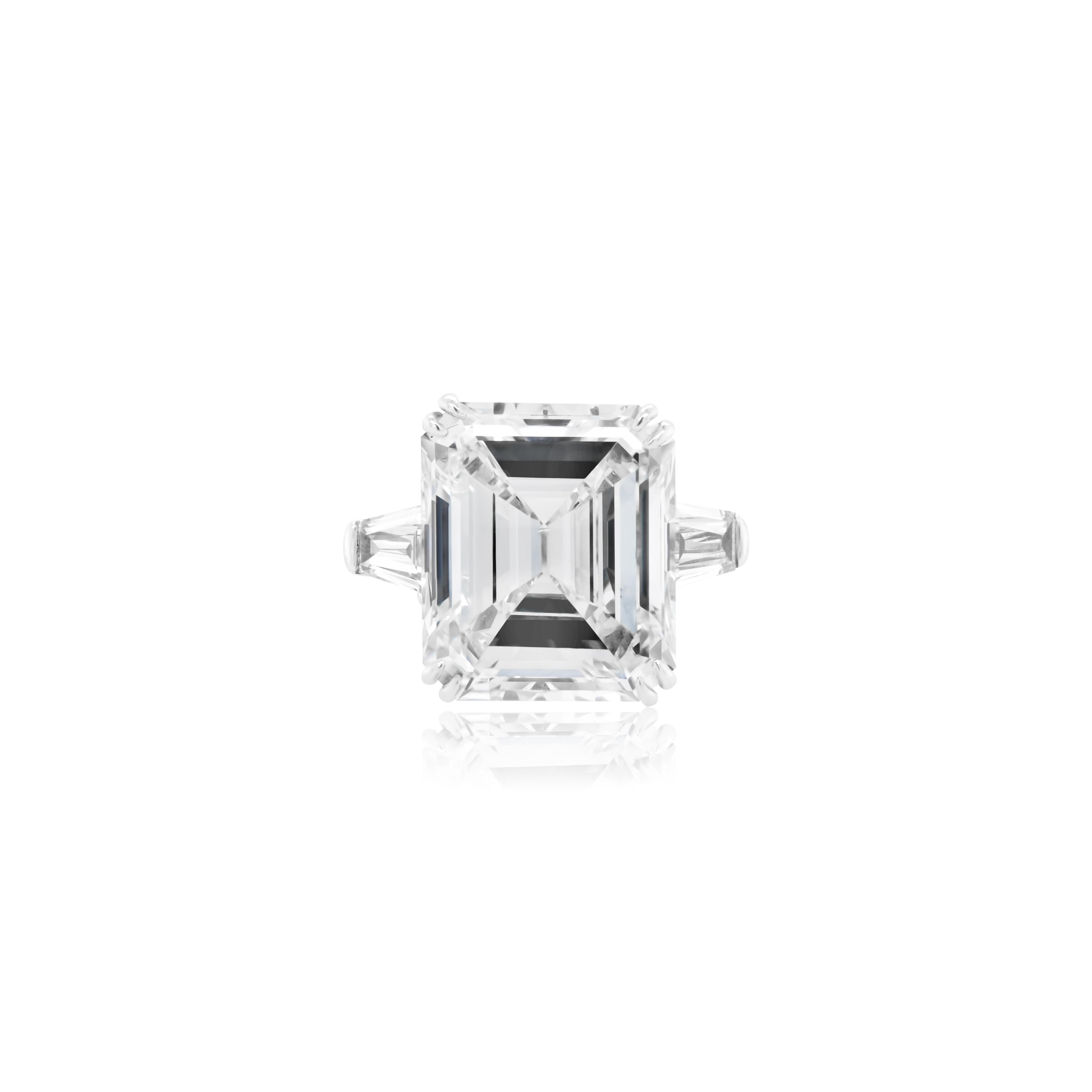 Platinum custom emerald cut diamond ring. 10.03ct diamond color J  clarity SI1  GIA certified set with .60cts tapered baguettes 100% eye clean size 6.5 