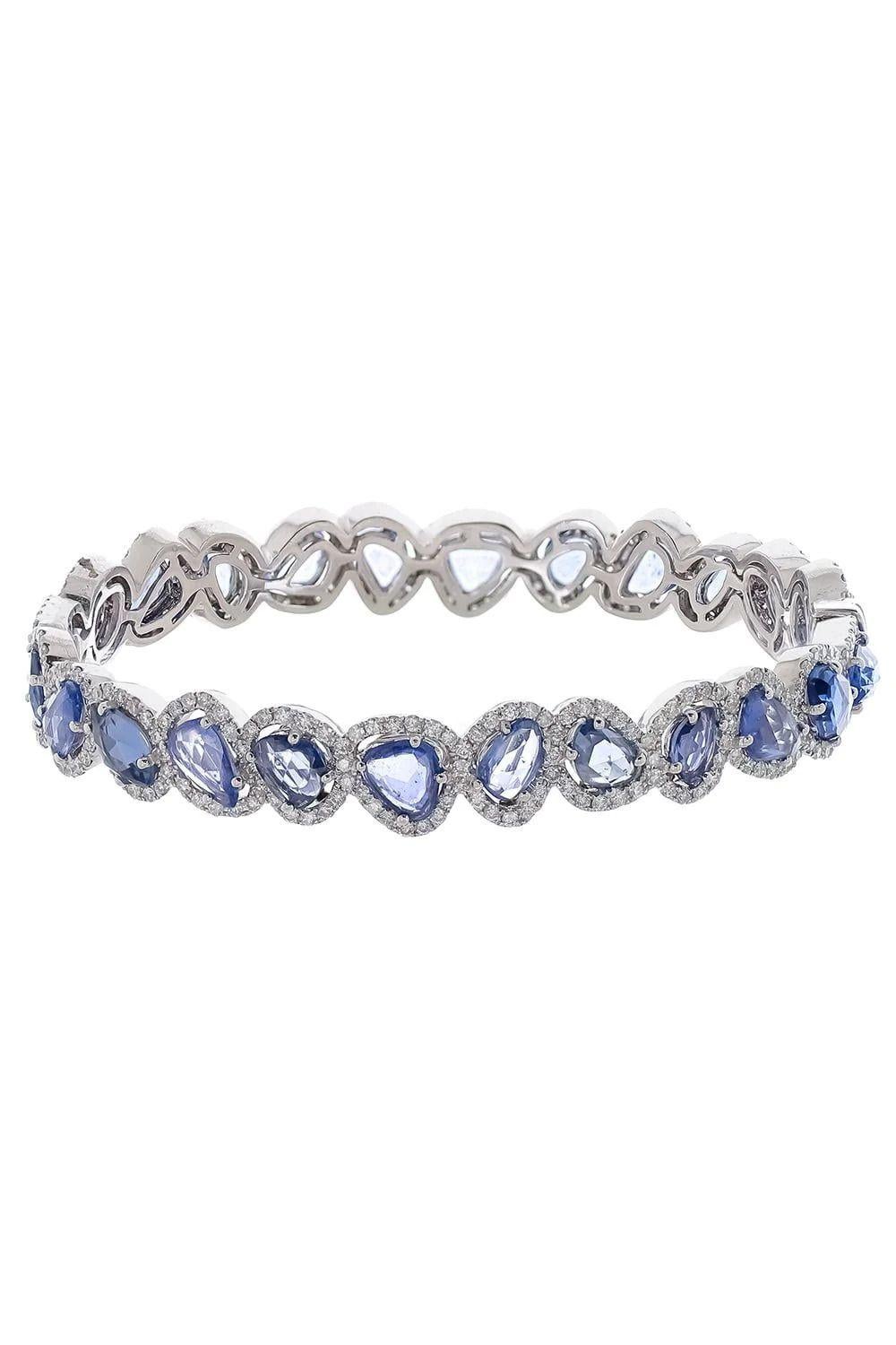 18 kt white gold diamond bangle adorned with 13.03 cts tw of rose cut sapphires laid in varying angles surrounded by 3.00 cts tw of diamonds going all around