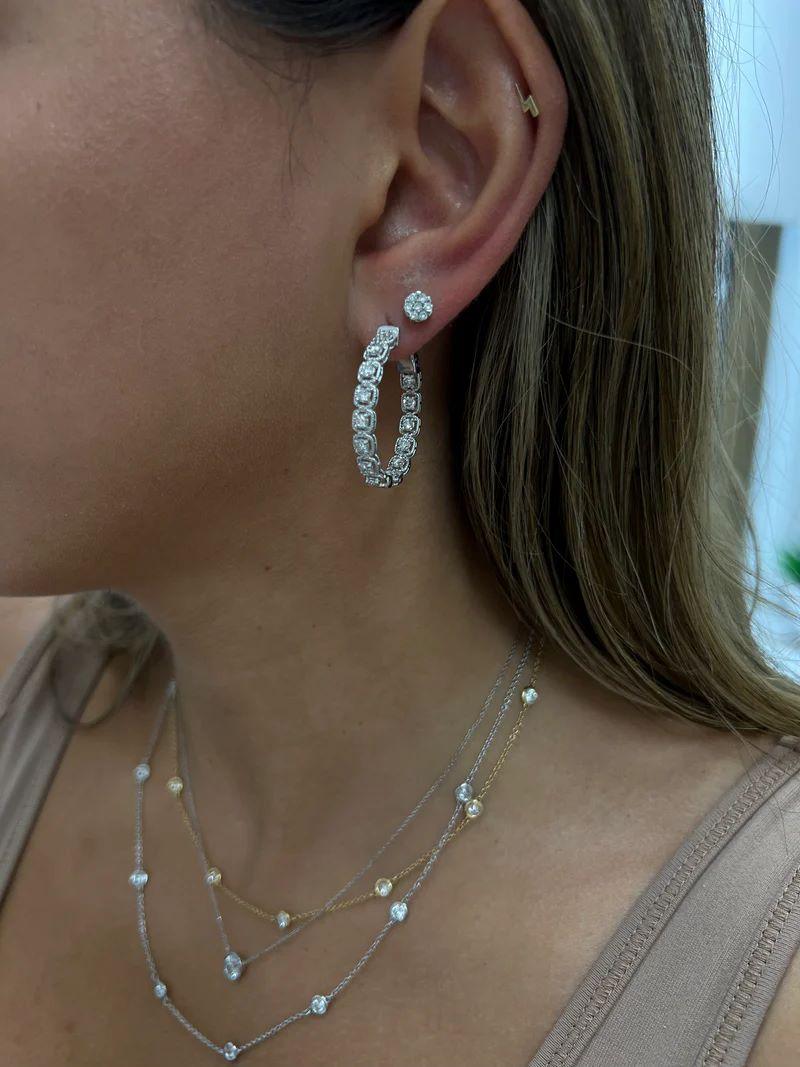 A&M. Boucles d'oreilles en or blanc 14 carats, 1