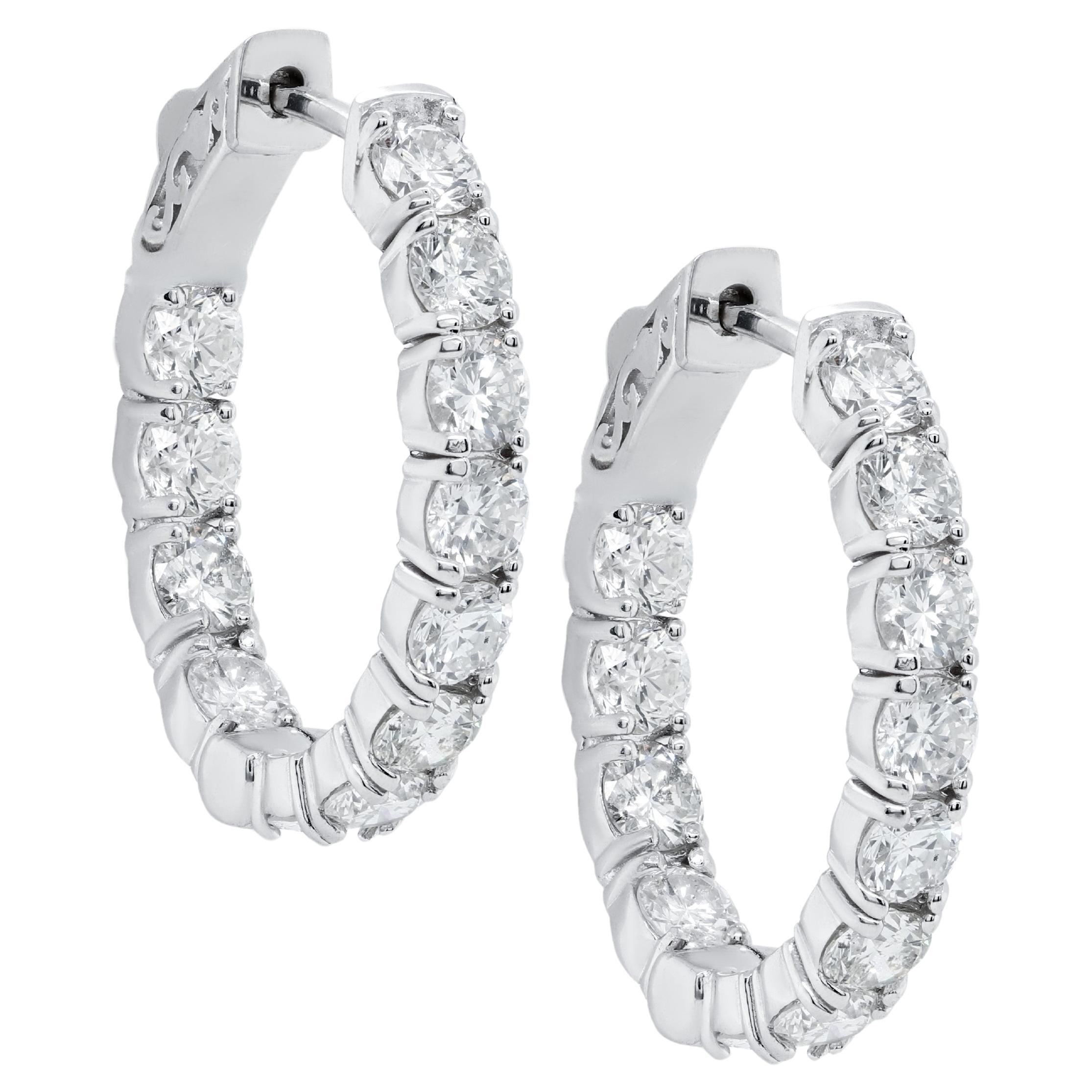 Diana M. 14 kt white gold, 1" hoop earrings featuring 3.00 cts tw round diamonds For Sale
