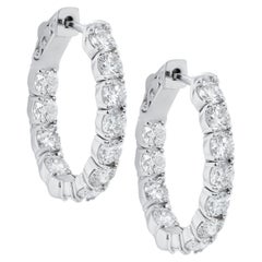 Diana M. 14 kt white gold, 1" hoop earrings featuring 3.00 cts tw round diamonds