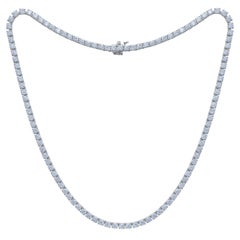 Diana M. 14 kt white gold, 18" 4 prong diamond tennis necklace featuring 10.50 