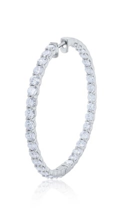 Diana M. 14 kt white gold, 2.00" inside-out hoop earrings adorned with 9.45 cts