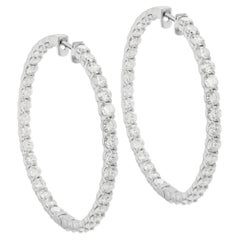 A&M. Boucles d'oreilles en or blanc 14 carats, 2.00" inside-out earrings ornées de 9.45 cts. 