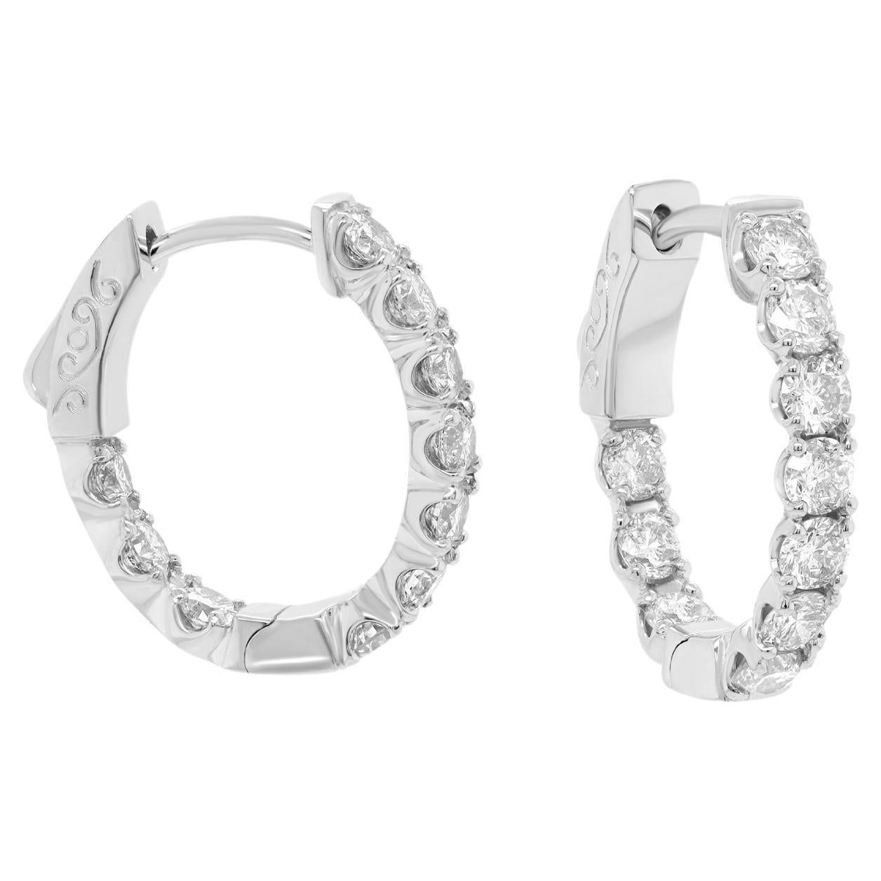 Diana M. 14 kt white gold, .50" oval hoop earrings featuring 1.65 cts tw diamond For Sale