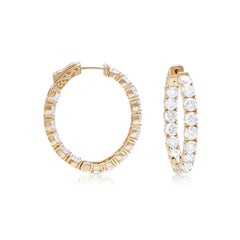 Diana M. 14 kt yellow gold, .75" round hoop earrings featuring 2.70 cts tw round