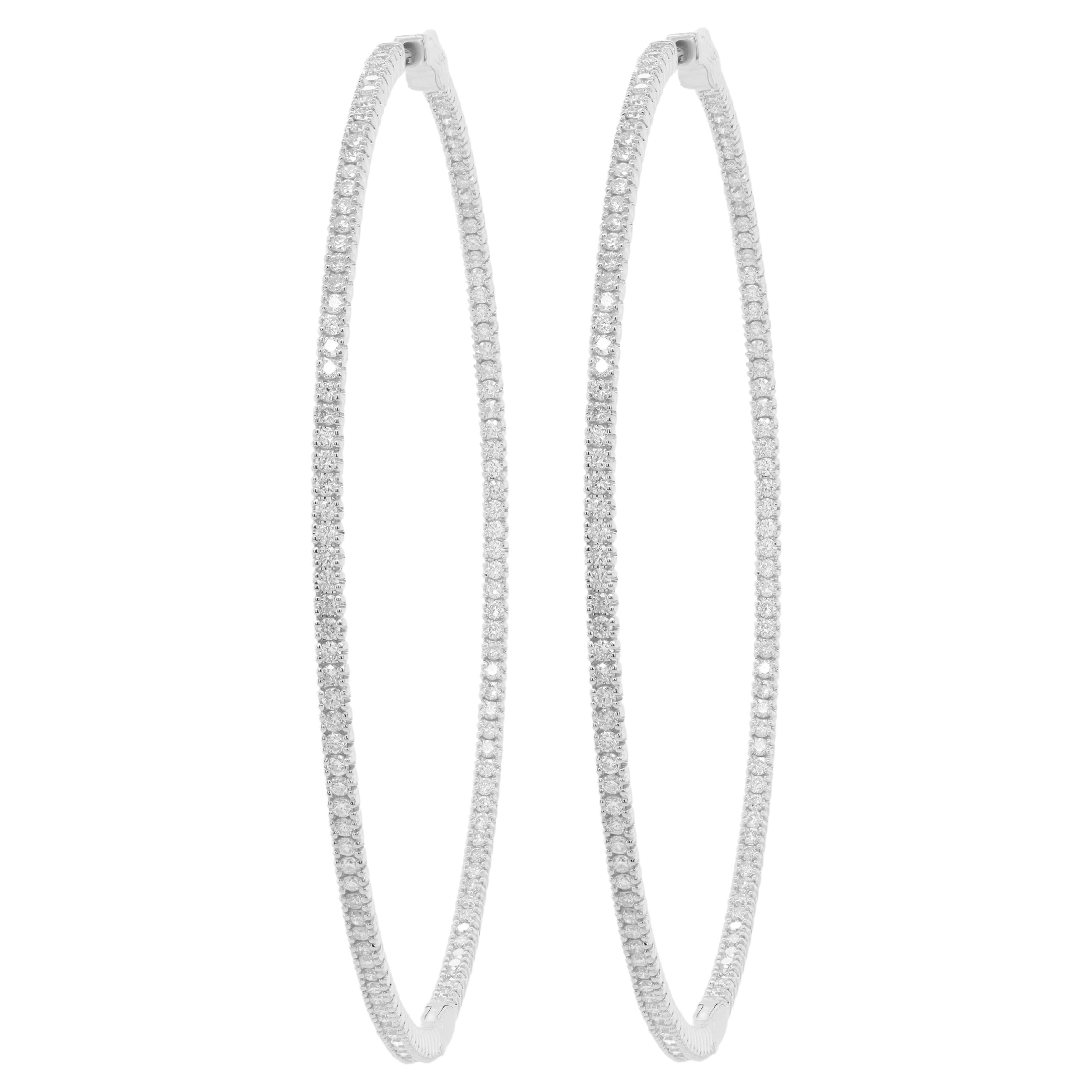 Diana M. 14kt white gold, 1.75" hoop earrings featuring 1.30cts  round diamond For Sale