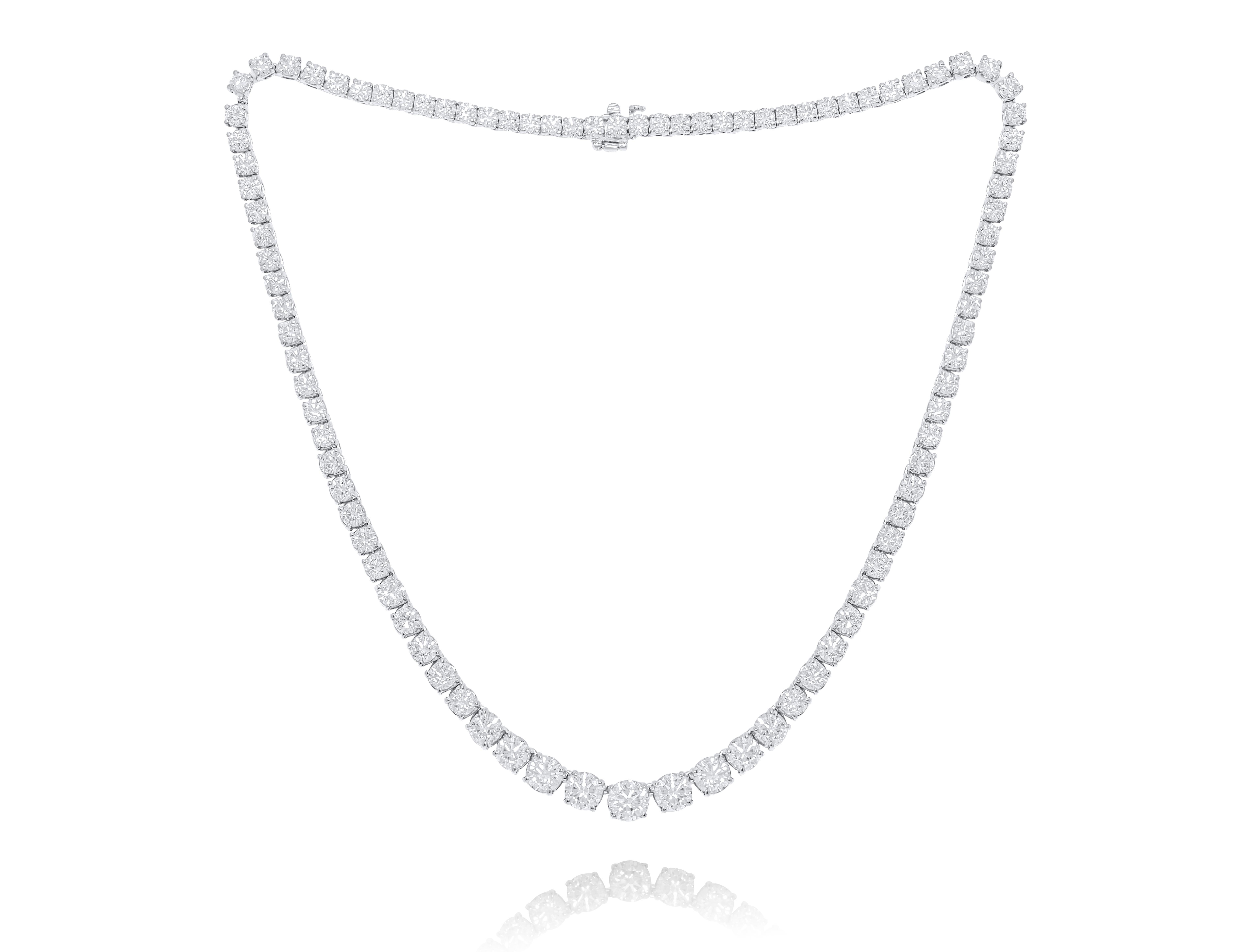 Custom 14k white gold graduated tennis necklace featuring 16.75 cts  round brilliant diamonds set in a 4 prong setting  107 stones  0.15 each FG color SI clarity. Excellent  cut. 
