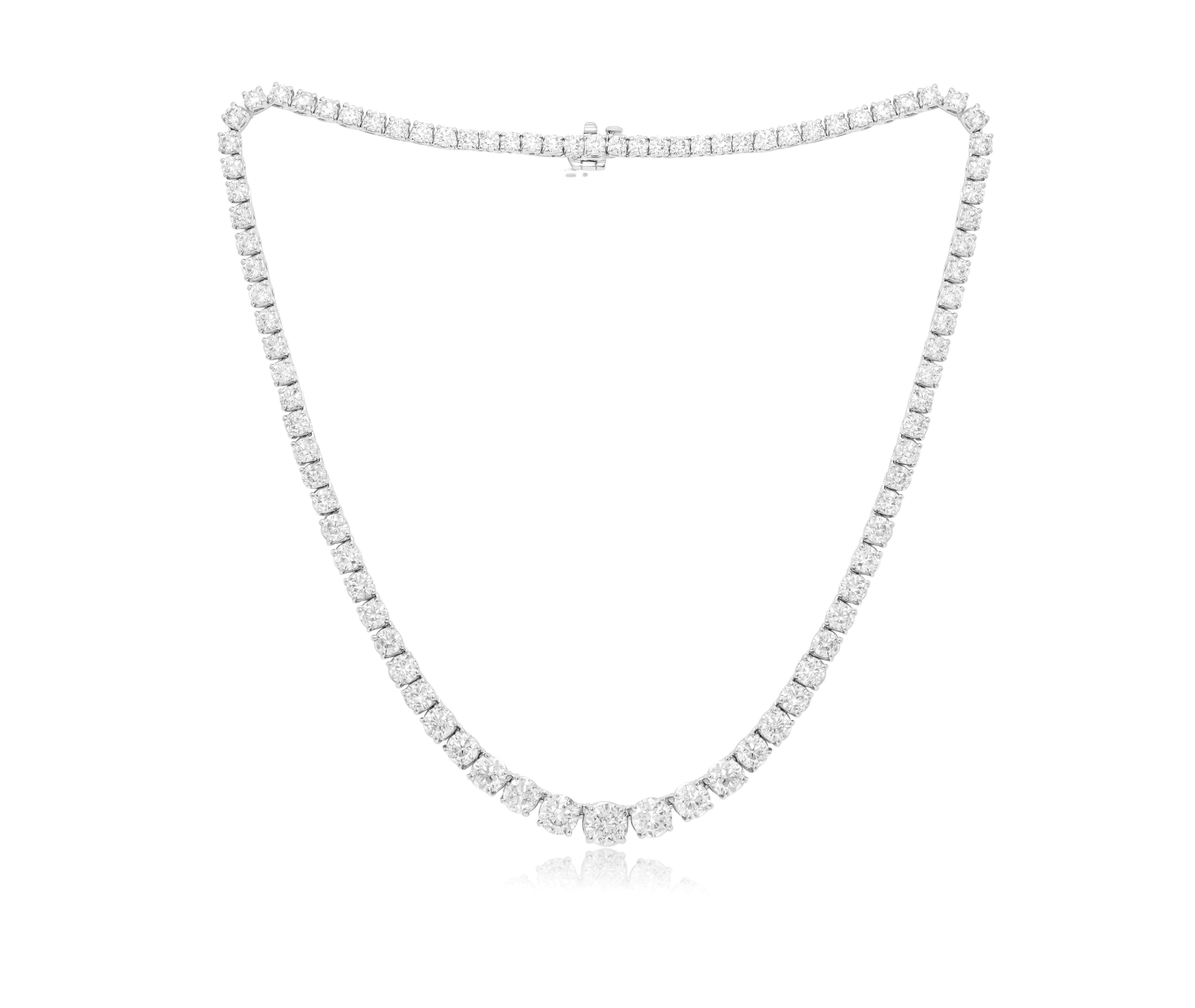 Custom 14k white gold graduated tennis necklace  17.60 cts  round brilliant diamonds 107 stones 0.16 each set in a 4 prong setting FG color SI clarity. Excellent  cut. 