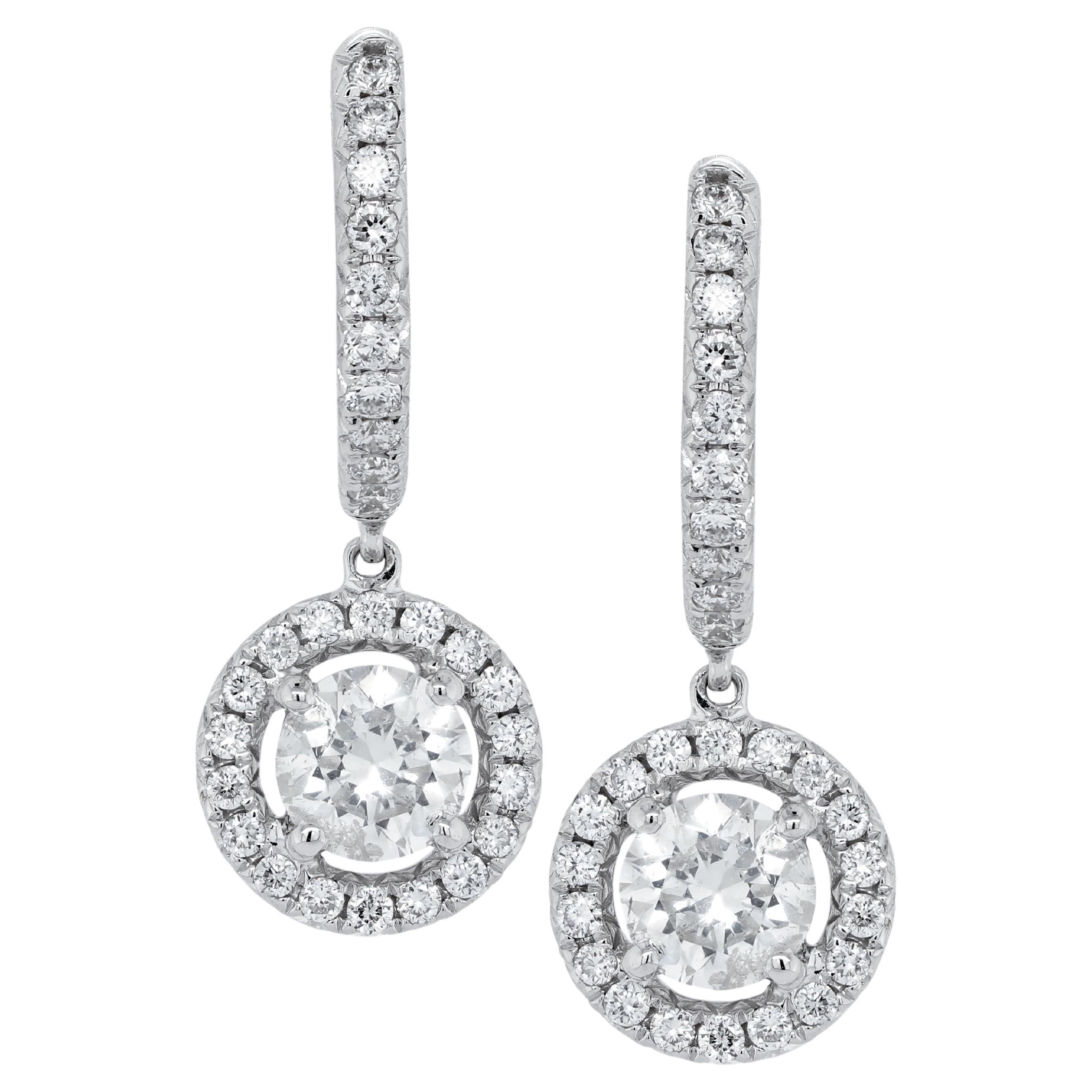 Diana M. 14kt white gold hanging earrings featuring 1.20 cts tw of round diamond For Sale