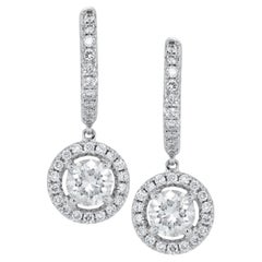Diana M. 14kt white gold hanging earrings featuring 1.20 cts tw of round diamond