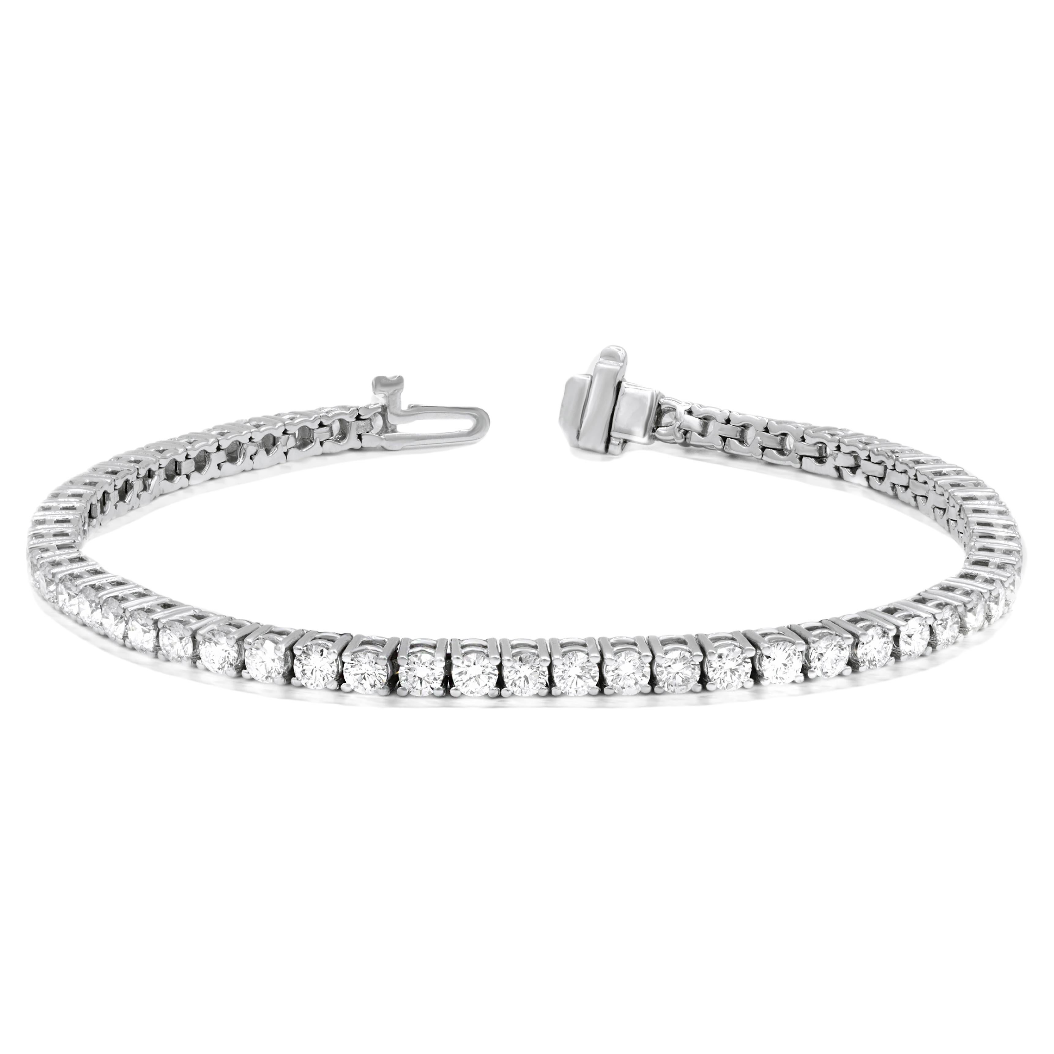 DIANA M. 14kt white gold tennis bracelet featuring 3.00 cts tw of round diamonds For Sale
