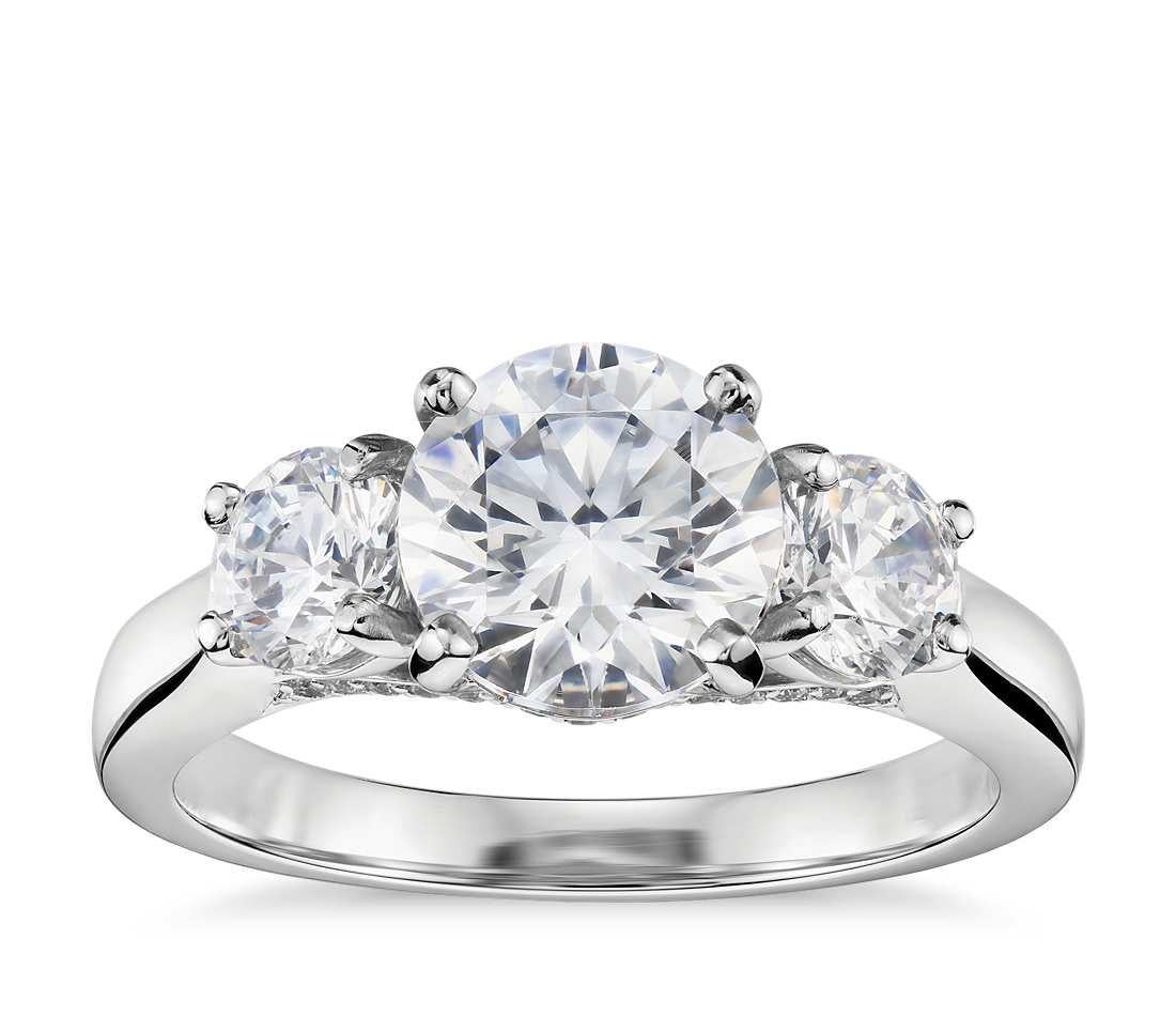 18 karat white gold diamond ring with 3 round brilliant cut diamonds featuring 1.50 cts total.GH SI