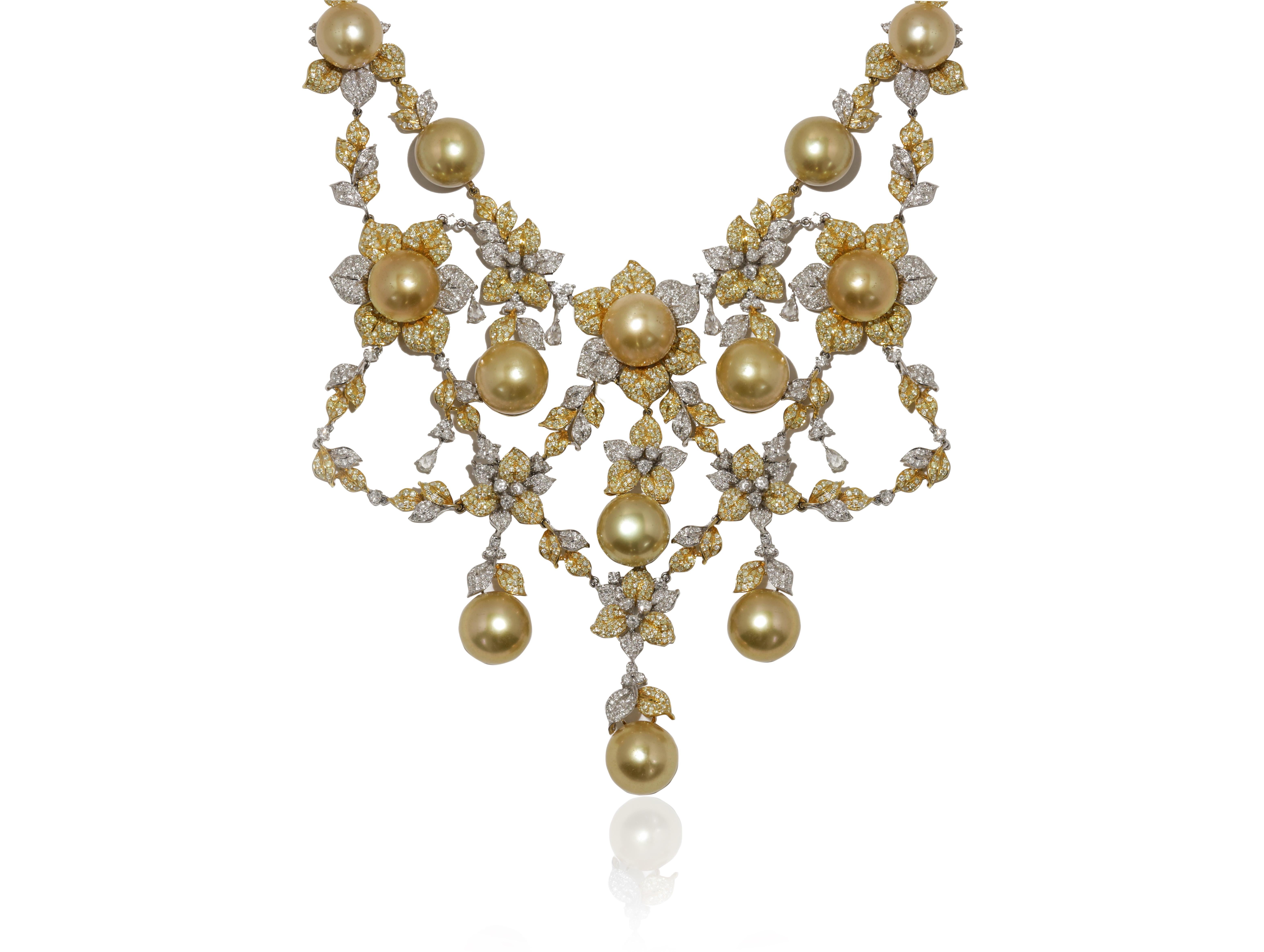18 kt two tone pearl and diamond necklace adorned with pearls surrounded by 19.66 cts tw of diamonds in a flower design and separated by leaves and diamonds.
Diana M. is a leading supplier of top-quality fine jewelry for over 35 years.
Diana M is