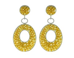 Diana M. 18 kt White and Yellow Gold Fancy Diamond earrings containing 20.12 cts