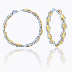 Diana M. 18 kt white and yellow gold inside-out hoop earrings