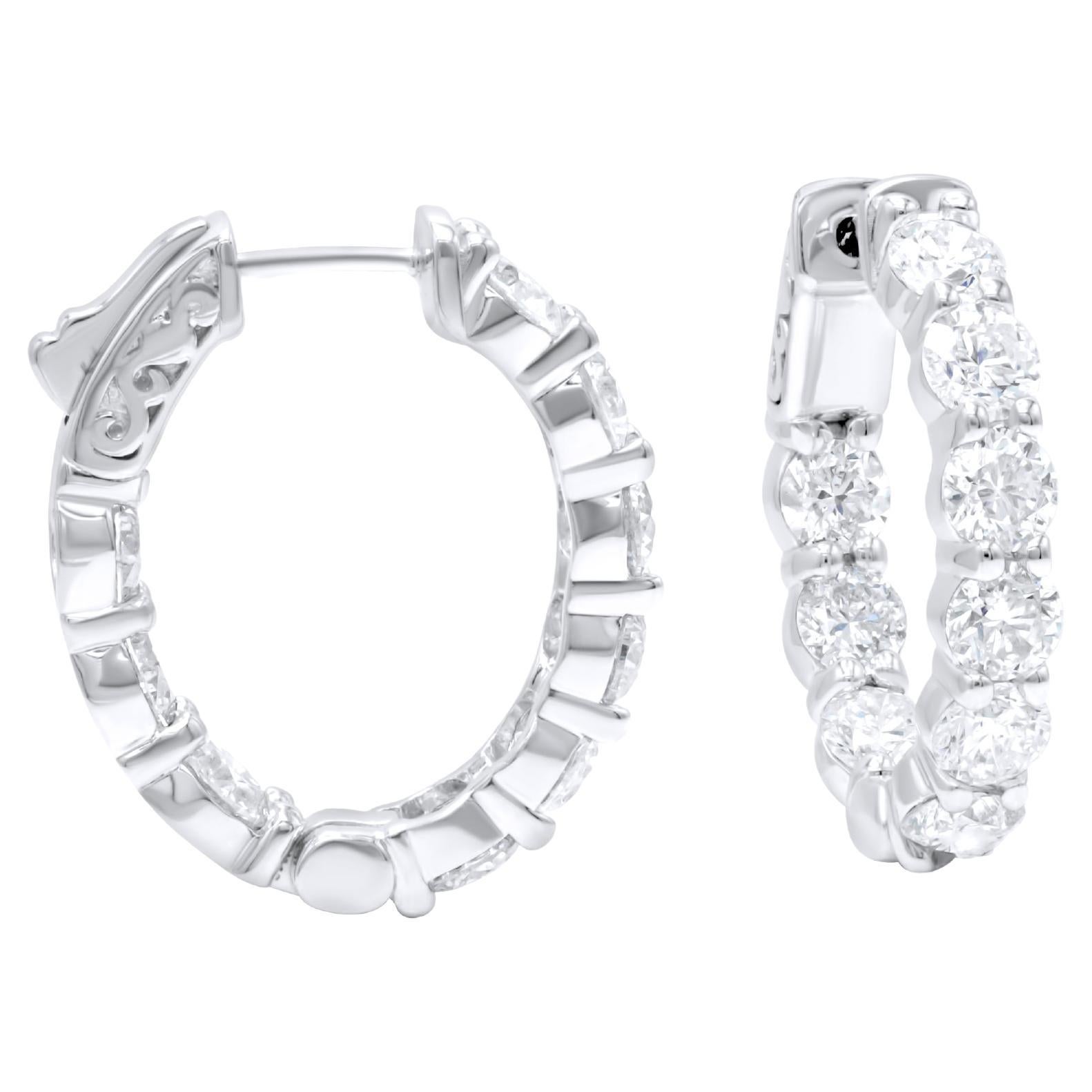Diana M. 18 kt white gold, 0.75" inside-out hoop earrings adorned with 4.55 cts  For Sale