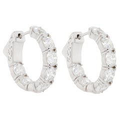 Diana M. 18 kt white gold, 0.75" inside-out hoop earrings adorned with 7.30 cts 