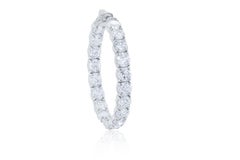 Diana M. 18 kt white gold, 1.50" inside-out hoop earrings adorned with 15.40 cts