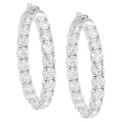 Diana M. 18 kt white gold, 1.50" inside-out hoop earrings adorned with 15.40 cts