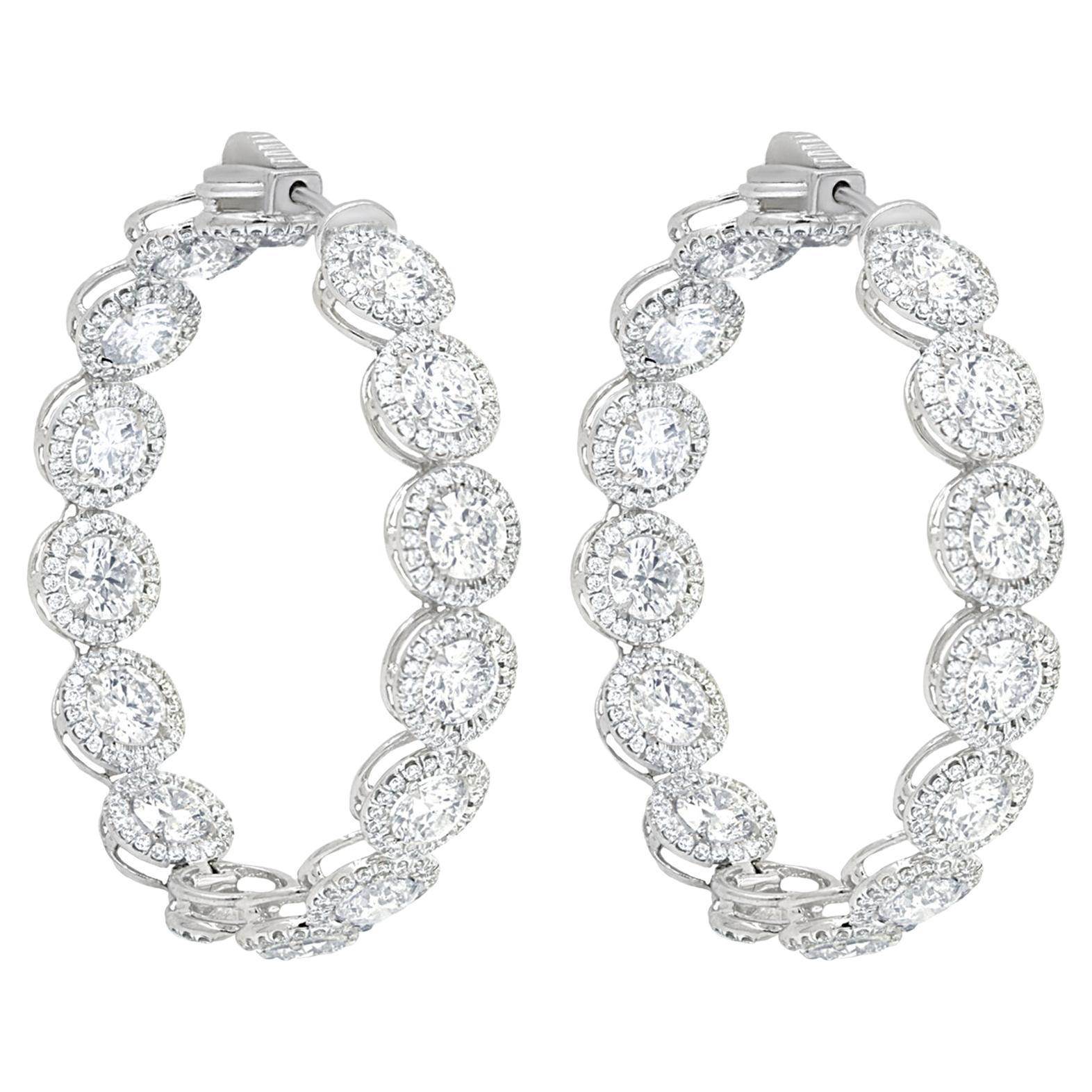 Diana M. 18 kt white gold, 1.50" inside-out hoop earrings with 12.20cts halo 