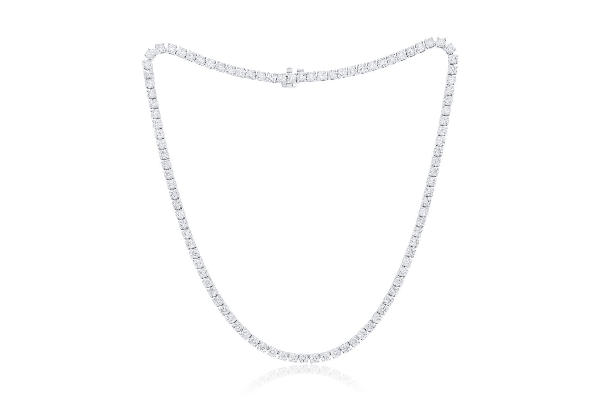Indulge in the timeless elegance of our 18kt White Gold 4-prong Diamond Tennis Necklace, a captivating adornment that exudes sophistication and luxury. This exquisite necklace features a stunning arrangement of round diamonds, totaling an impressive