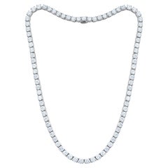 Diana M. 18 kt white gold, 16" 4 prong diamond tennis necklace featuring 28.40 