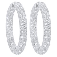 Diana M. 18 kt white gold, 2.25" inside-out hoop earrings adorned with 27.52cts 