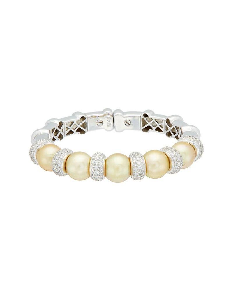 18 kt white gold diamond and pearl cuff featuring 11-12 mm south sea yellow pearls separated by rondels adorned with 3.30 cts tw of royal sienna style micro pave diamonds (F/G color, VS/SI clarity)