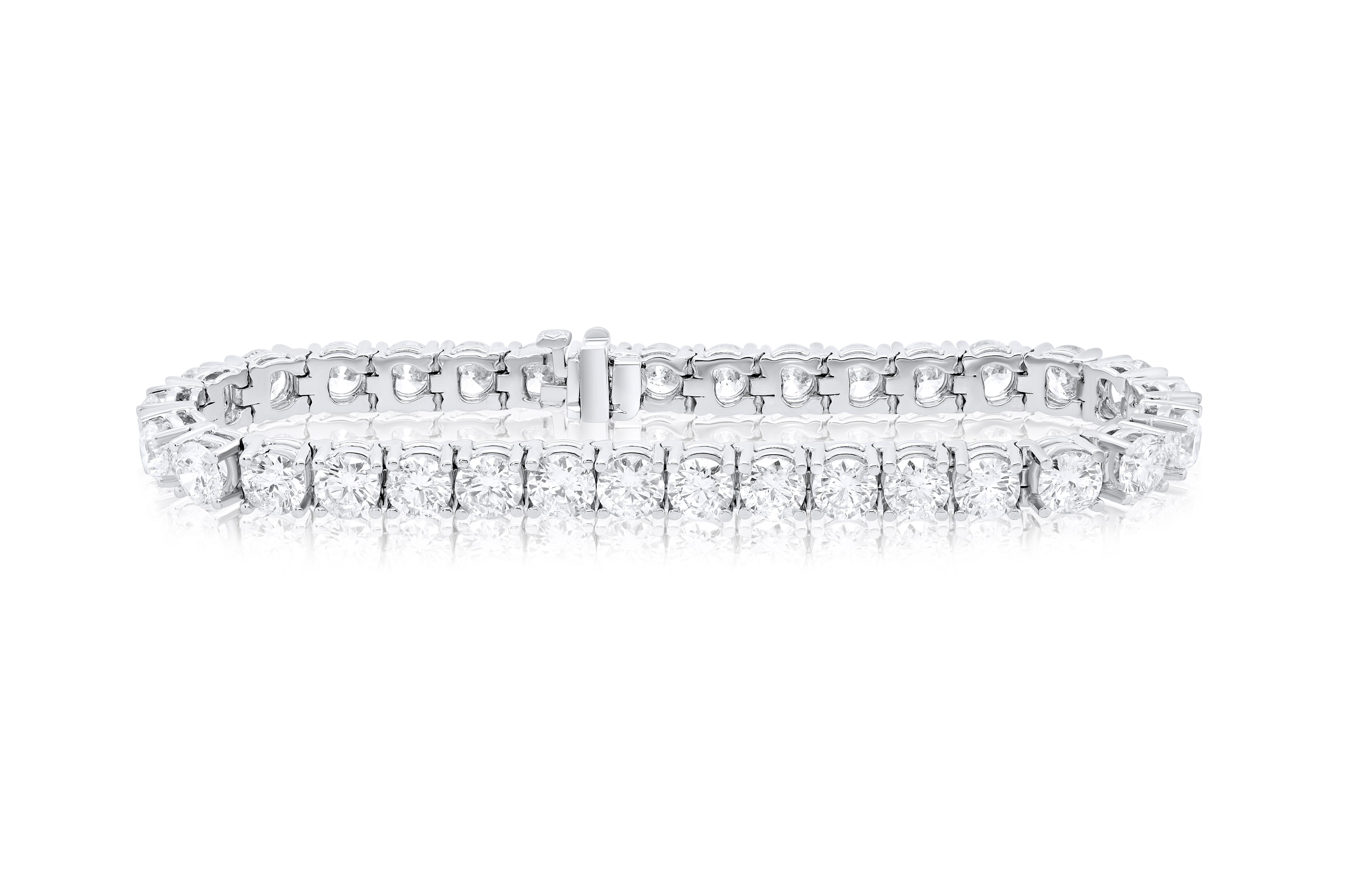 18 kt white gold 4 prong diamond tennis bracelet  16.70 cts of round diamonds 0.50 each carat 33 stones FG color SI clarity.  Excellent Cut.
