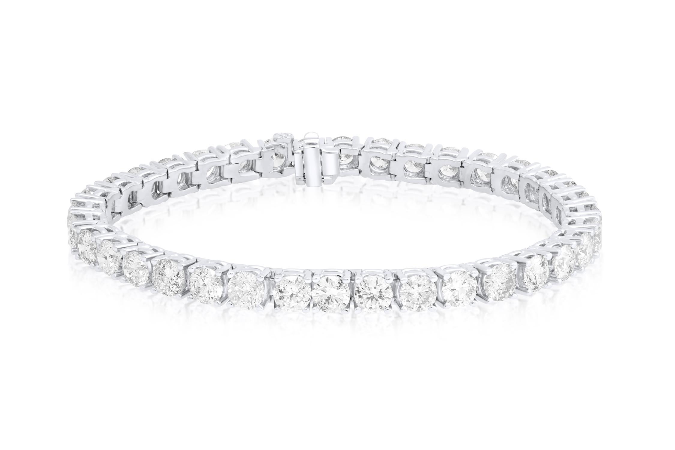 18 kt custom white gold 4 prong diamond tennis bracelet adorned with 8.75 cts round diamonds 42 stones 0.20 each stone FG color SI clarity.  Excellent Cut.