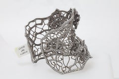 Diana M. 18 kt white gold diamond bangle in a vines and flowers design 20.61cts