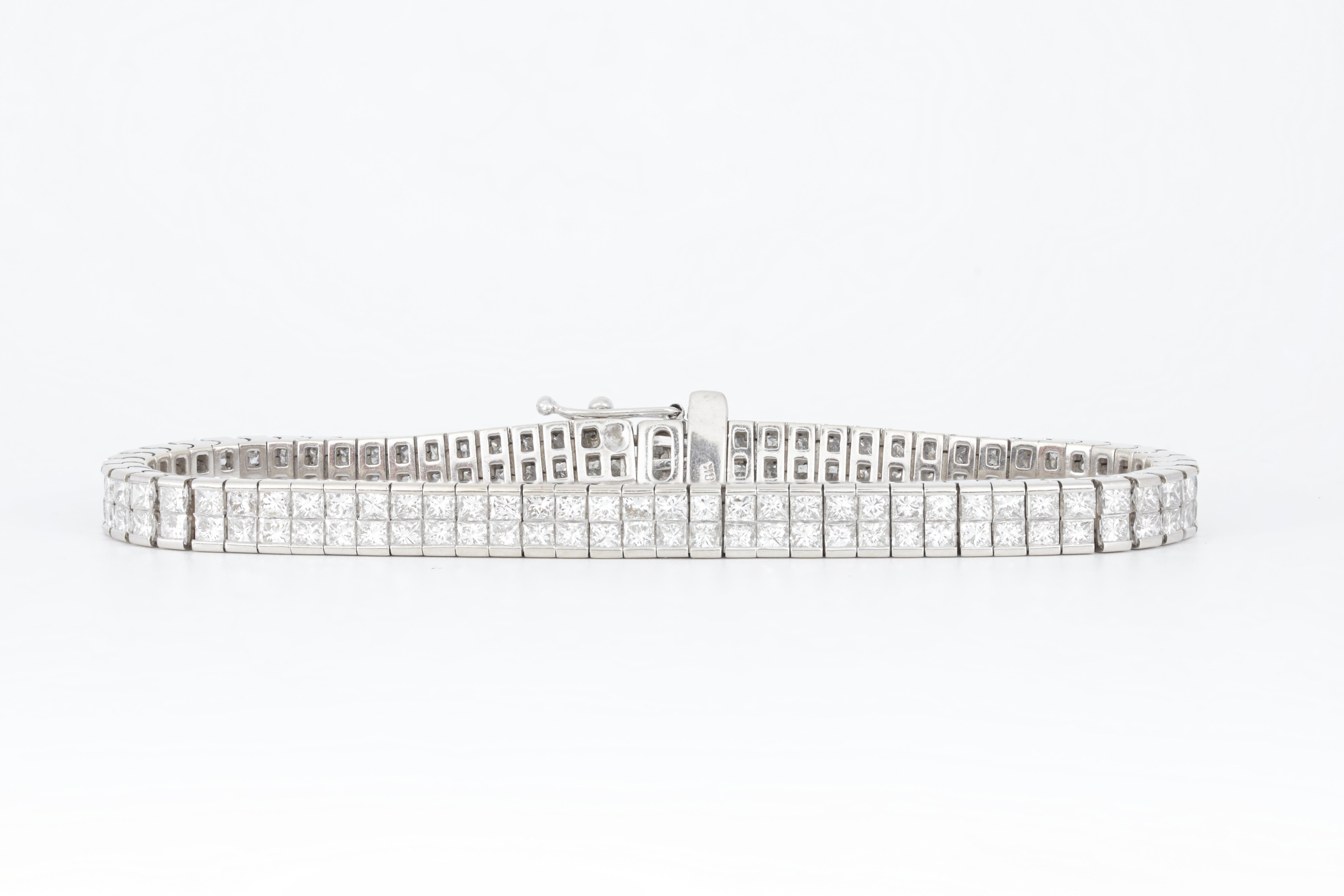 Round Cut Diana M. 18 kt white gold diamond tennis bracelet adorned with 2 rows of 12.30  For Sale