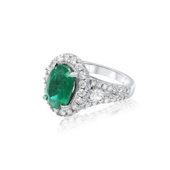 Diana M. 18 kt white gold emerald diamond ring featuring a 5.60 ct oval cut