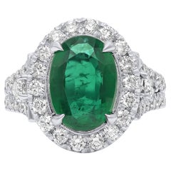 Diana M. 18 kt white gold emerald diamond ring featuring a 5.60 ct oval cut