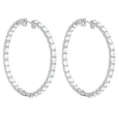 Diana M. 18 kt white gold inside-out hoop earrings adorned with 15.60 cts