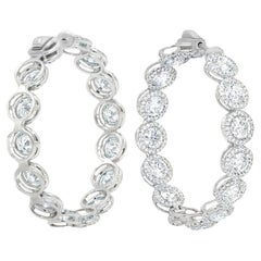 Diana M. Boucles d'oreilles en or blanc 18 carats avec halo