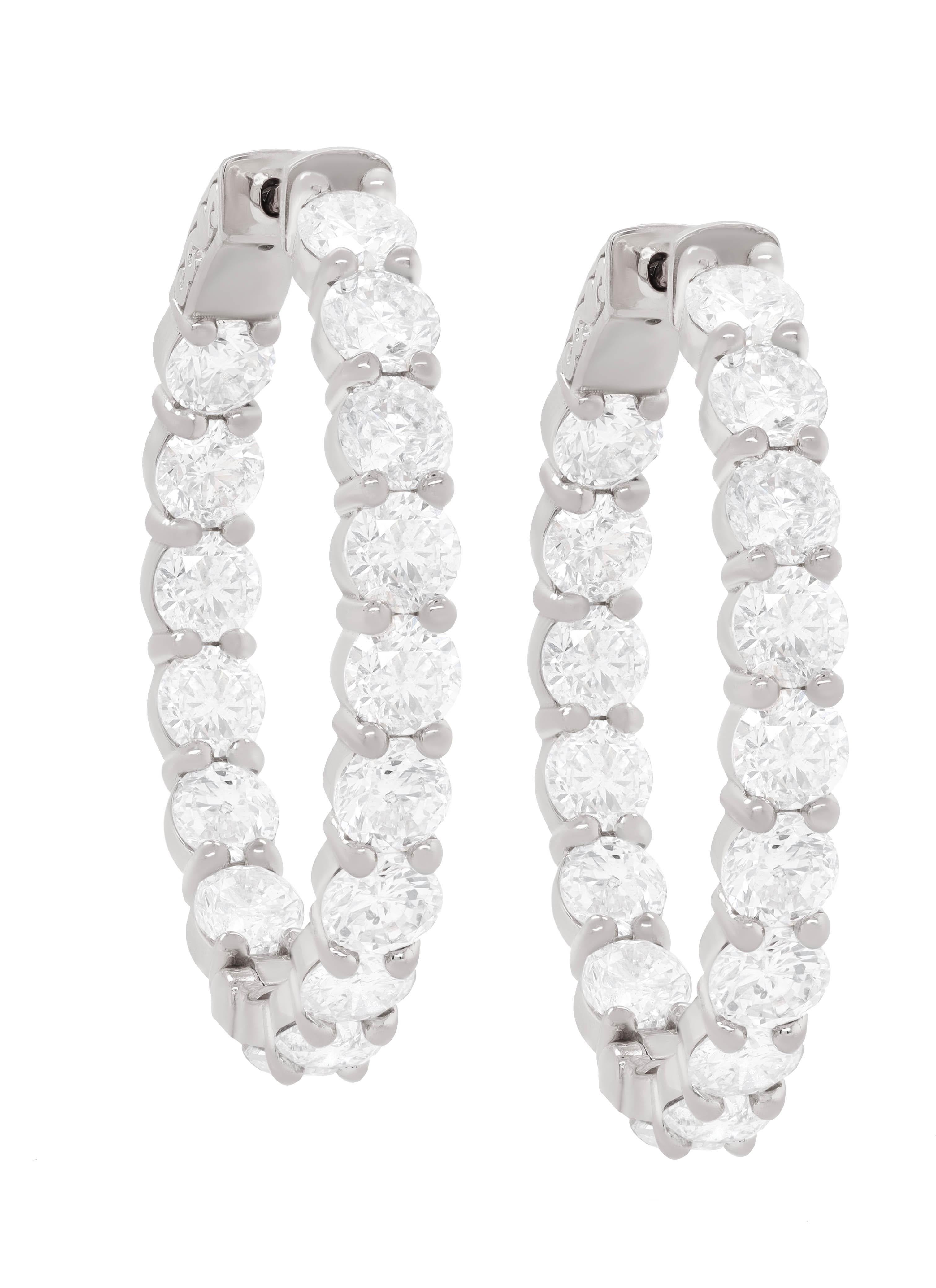 18 kt white gold inside-out oval shape hoop earrings adorned with 8.60 cts tw of round diamonds (32 stones)
Diana M. is a leading supplier of top-quality fine jewelry for over 35 years.
Diana M is one-stop shop for all your jewelry shopping,