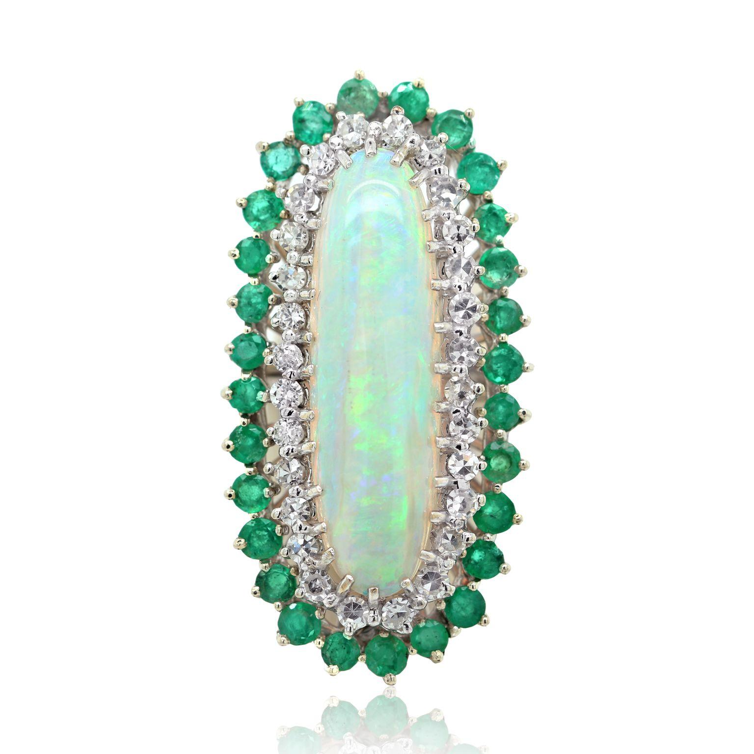 18 kt white gold opal, emerald, and diamond ring featuring a 7.00 ct oval cut opal surrounded by a layer of diamonds and a layer of emeralds totaling 5.00 cts tw.
Diana M. is a leading supplier of top-quality fine jewelry for over 35 years.
Diana M